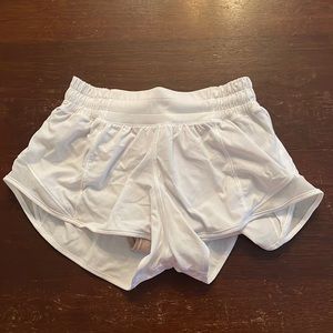 White Lululemon shorts. Size 0. In good condition (slightly freyed)